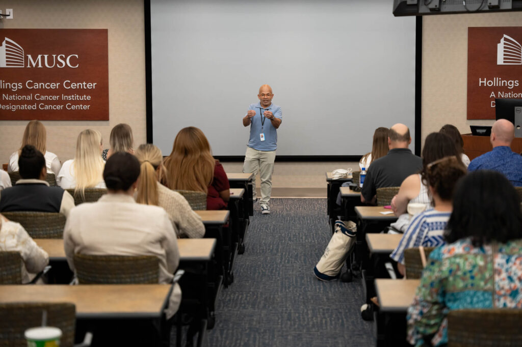 Site Photo - Craig Lockhart, M..D., MUSC Hollings Cancer Center associate director for clinical science, talks to the Clinical Trials Office staff.